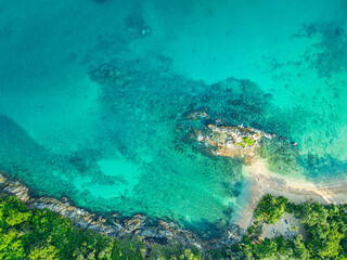 aerial top view above small island in front of Yanui beach in low tide. Sand dunes in the separate sea. Sandbars form in the Separated Sea when the water level goes down. green sea white sand beach.