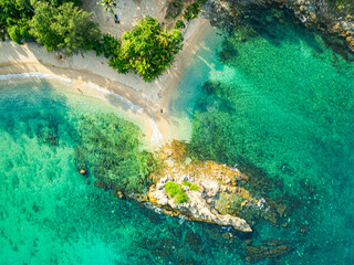 aerial top view above small island in front of Yanui beach in low tide. Sand dunes in the separate sea. Sandbars form in the Separated Sea when the water level goes down. green sea white sand beach.