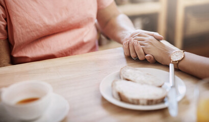 People, holding hands and trust in nursing home for help, support and hope in living room. Women,...