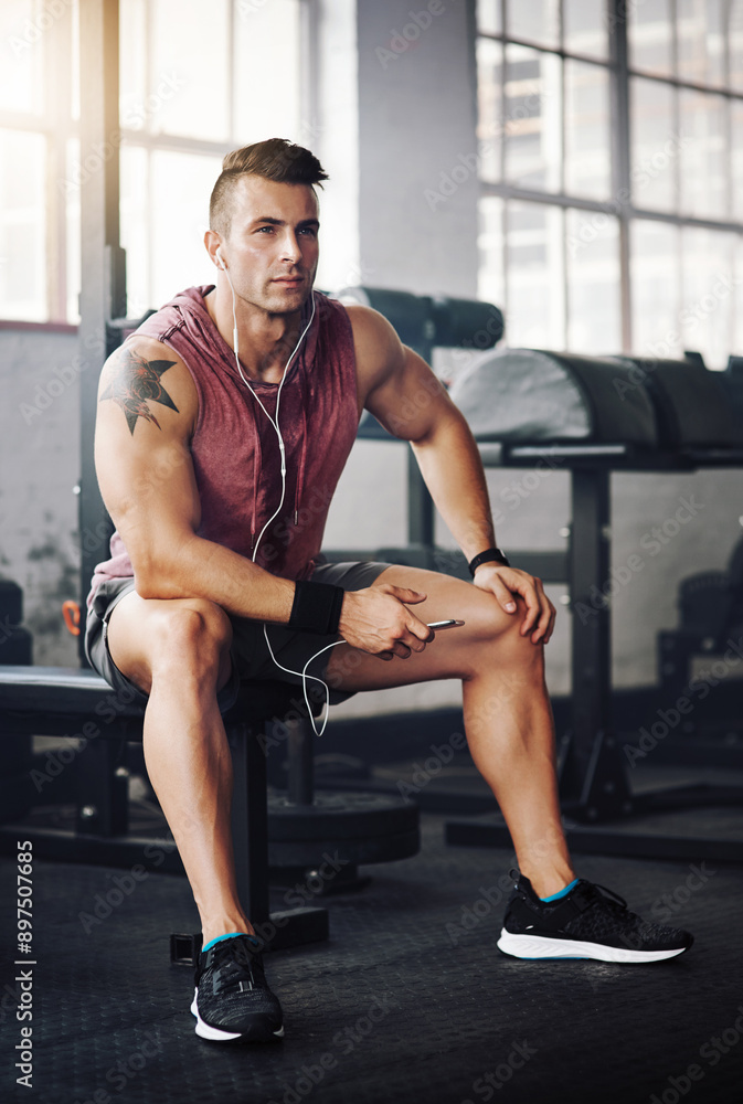 Poster man, phone and thinking in gym for relax, exercise and playlist with radio for motivation. training,