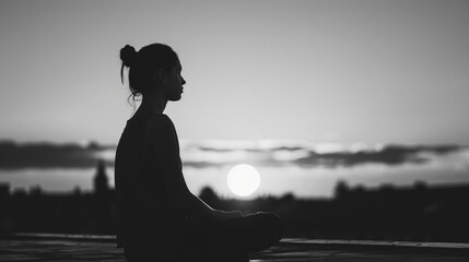 Serene Reflections - Young Woman Silhouette on Rooftop at Sunset