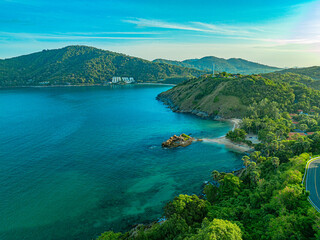 Aerial view smooth waves in green sea at Yanui beach.White sandy beaches, green waters, large rocks and pristine forests. .smooth wave after wave crashed onto the shore.