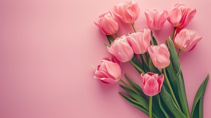 Obraz premium Mother s Day floral arrangement Pink tulip bouquet on pastel background Mockup with space Top down view