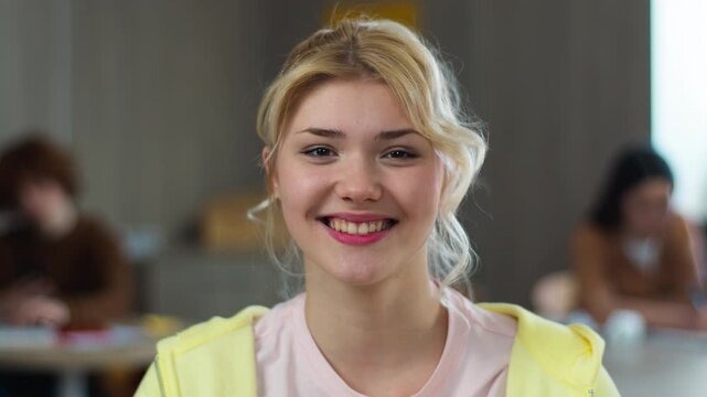 High school university teenager education study happy smiling carefree cheerful glad positive face Caucasian girl teen female woman schoolgirl student studying learning college smiling at camera class