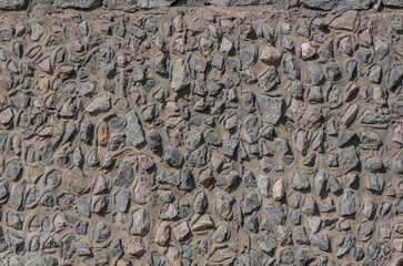 fence real stone wall surface with cement as background.