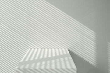 minimal white interior with wall and contrast of light and shadow