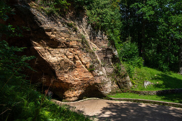 a beautiful described cave in a macaw park in a sunny day