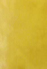 Texture of genuine leather, artificial leatherette yellow background
