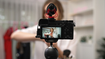 Woman influencer shoot live streaming vlog video review makeup prim social media or blog. Happy young girl with cosmetics studio lighting for marketing recording session broadcasting online.