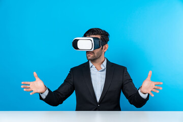 Smart businessman sitting while pointing and choosing data analysis by using technology innovation. Professional caucasian project manager using virtual reality glasses and VR goggles. Deviation.