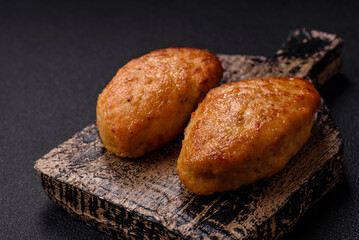 Delicious fresh fried minced fish cutlets with spices and herbs