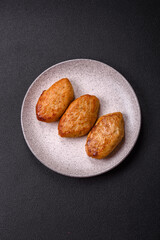 Delicious fresh fried minced fish cutlets with spices and herbs