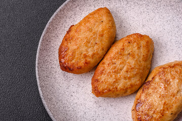 Delicious fresh fried minced fish cutlets with spices and herbs