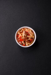 Delicious asian udon dish with vegetables, meat, salt and spices