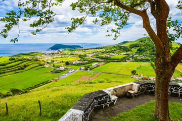Picnic area and viewpoint over green meadows and hills in rural farming interior, Faial island,...