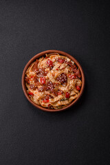 Delicious asian udon dish with vegetables, meat, salt and spices