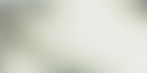 Visible grainy texture on a brushed metal surface reflecting light