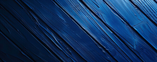 Obraz premium A rich blue background with a subtle texture of diagonal stripes, adding depth and interest while maintaining the boldness of the color.