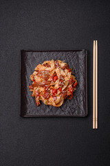 Delicious asian udon dish with vegetables, meat, salt and spices