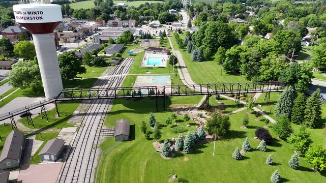 Palmerston water tower with bridge in Town of Minto with residential areas and green surroundings