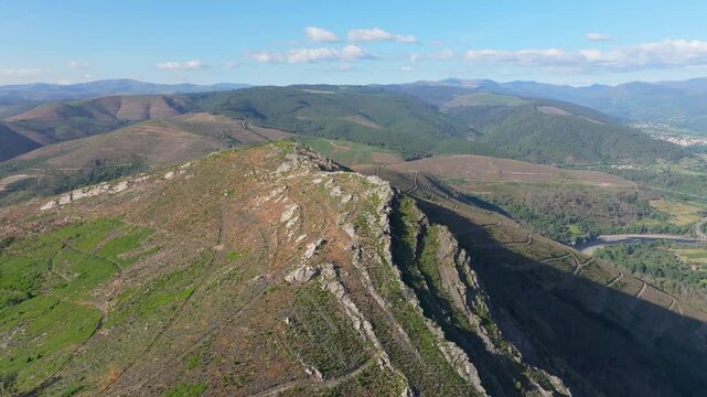 mountainous Landscape Near Nogueira, Ribas de Sil, Spain with blue sky in the background