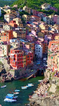 vertical aerial video of Cinque terra in Italy, Riomaggiore town in Cinque terra on Italian riviera, vacation in Liguria, Italy, holiday in Italy
