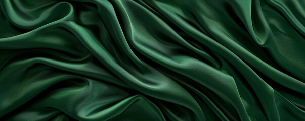 Obraz premium A rich green background with a satin-like texture, creating a luxurious and elegant appearance.