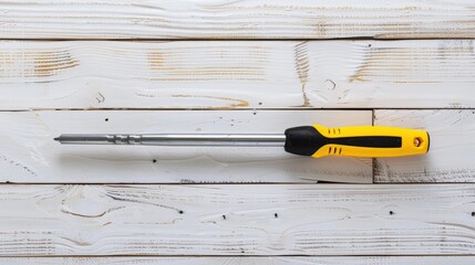 Flat file with yellow and black handle on white wood background Tool for wood and metal work Maintenance and building projects Space for text Front perspective