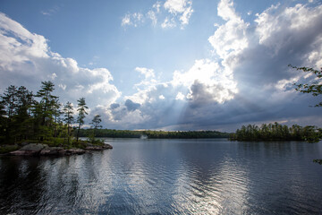 A beautiful vista showing a small tree-filled island on a lake in Ontario.