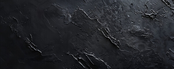 Obraz premium A smooth black background with a subtle grainy texture, providing a slightly organic and natural feel.