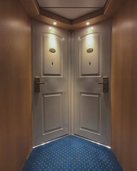 Corridor or aisle to cabins, staterooms or suites on classic luxury cruise ship or ocean cruiseship...
