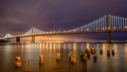 San Francisco Bay bridge. Also known as the San Francisco - Oakland Bay Bridge, is a complex of bridges spanning San Francisco Bay, California, United States of America