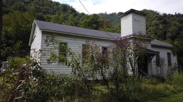Houses and streets in the abandoned coal mining town with a railroad through the middle of it in southern West Virginia.
