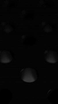 White glowing spheres jump from one hole to another. Dark reflective surface with holes and bouncing balls. 3D looped animation abstract render. Minimal black motion Vertical video