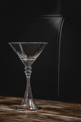 isolated low key martini cocktail glass with letter couch background
