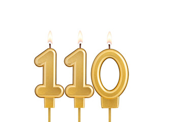 Birthday candle number 110 on white background
