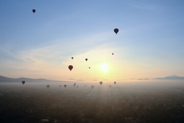 Hot Air Balloons Over Misty Teotihuacan Landscape At Sunrise, Mexico City