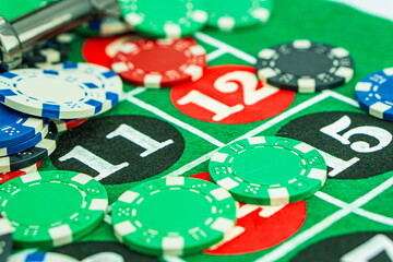 Poker Table With Poker Chips Turns In Casino. Many Poker Chips Spins on the Table in Darkness.