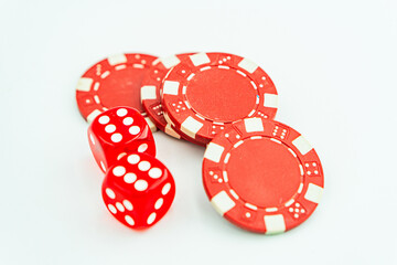 Gambling chips over white Poker chips and dice on white background