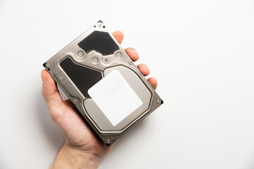 hard drive in a man's hand. Data repair and recovery concept