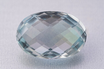 natural blue topaz gem on the isolated white background