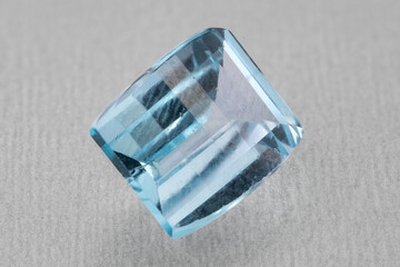 natural blue topaz gem on the isolated white background