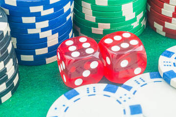 Casino background. Roulette table Chips. Casino theme. High contrast image of casino roulette, poker game, dice game, poker chips on a gaming table