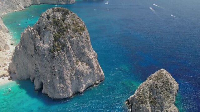 The drone aerial footage of Mizithres beach, Zakynthos Island, Greece. The two conical huge rocks, that bounce from the crystal blue waters in Keri, are called the Small and Big Mitzithra.