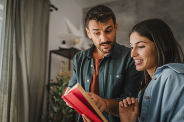 Boyfriend show and explain interesting part of book to his girlfriend