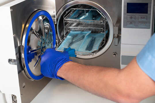 Sterilization of medical instruments in autoclave in podiatry clinic