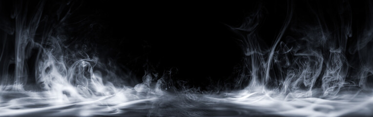 Real smoke exploding outwards with center space. Dramatic smoke or fog effect for spooky Halloween background or wallpaper.