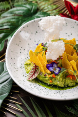 Avocado Mousse with Edible Flowers, Microgreens and Corn Chips