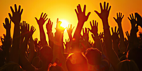 Voice of the People: A crowd of people, their hands raised in the air, silhouetted against the setting sun