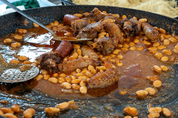 Fabada asturiana or Cassoulet from Aude department in Occitanie, bean stew, Spain, made large white beans, shoulder pork, pancetta or bacon,  mutton and preserved goose on local market
